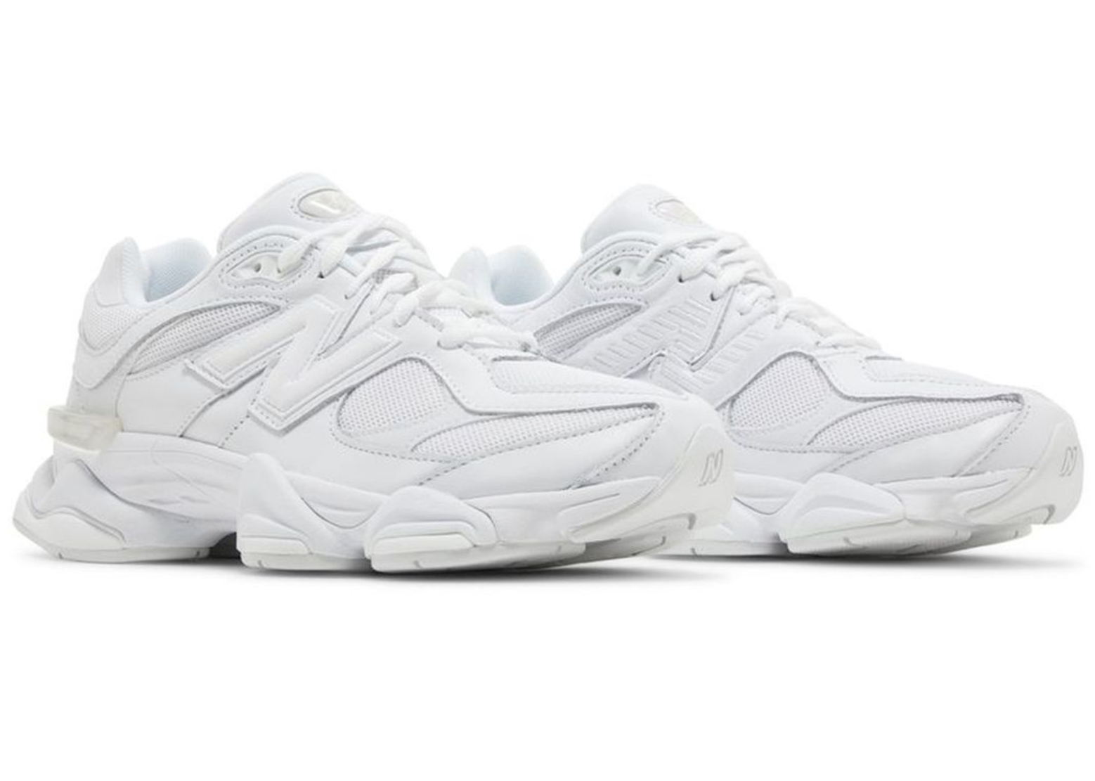 Side view of the New Balance 9060 Triple White shoe showing mesh and suede construction with a chunky sole