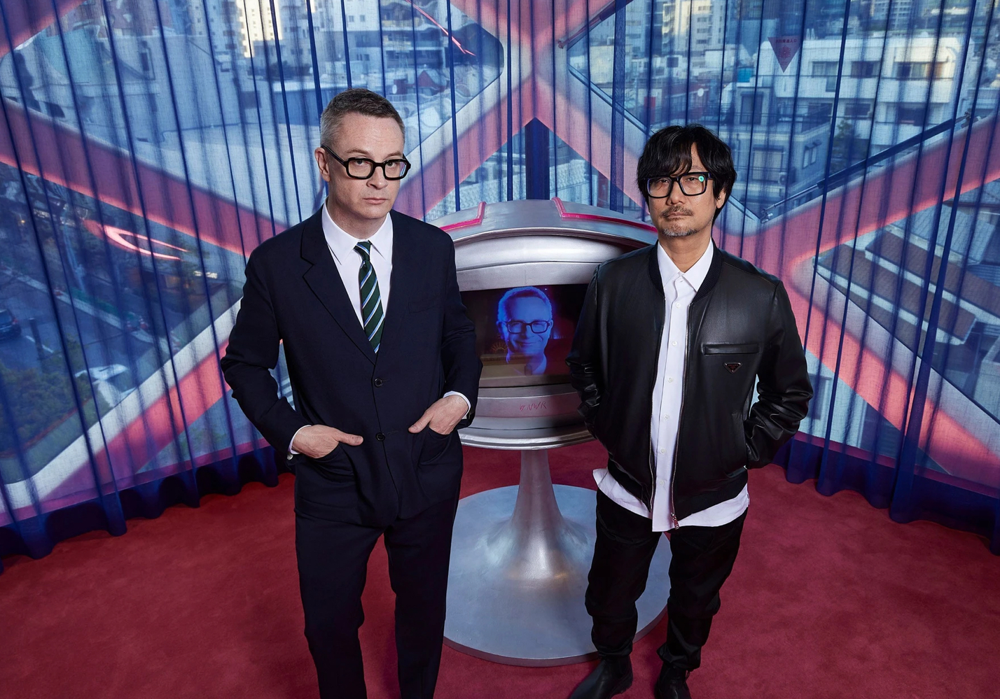 Kojima and Refn on surrounded by cinematic lighting and game-like set design