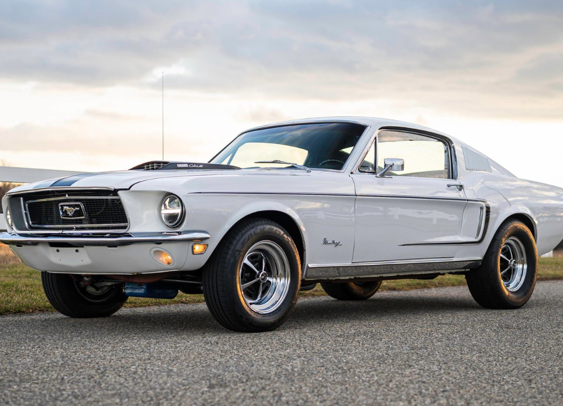 Restored 1968 Ford Mustang Fastback with 428 Cobra Jet engine featuring modern suspension and vintage bodywork