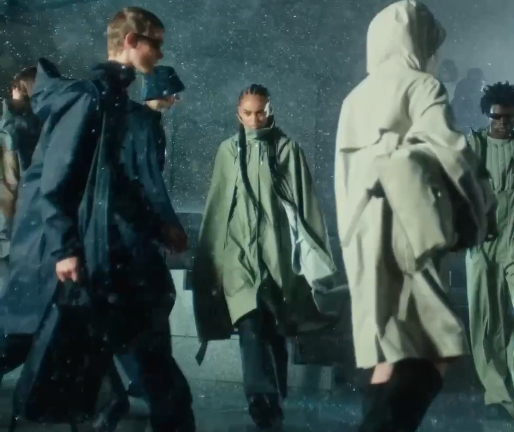 Rains Core Collection showcasing minimal waterproof outerwear and pants in signature coated matte fabric, windproof and breathable