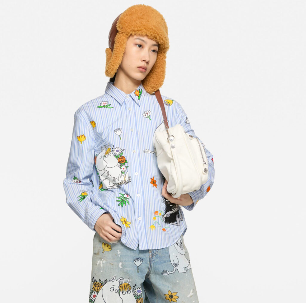 Acne Studios x Moomin FW25 sweater featuring Stinky motif, displayed in pastel-colored Scandinavian