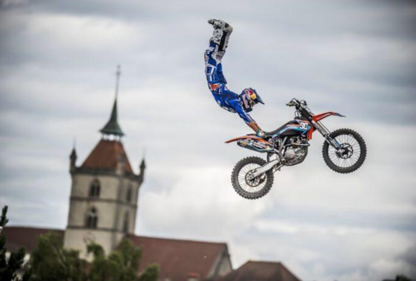 Robbie Maddison mid-air on a motocross bike, silhouetted against the sky