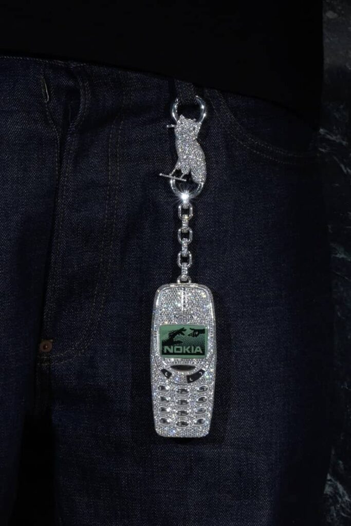 Custom iced-out Nokia phone and “SSS4U” diamond pendant created by Alex Moss NY for Drake, totaling over 150 carats