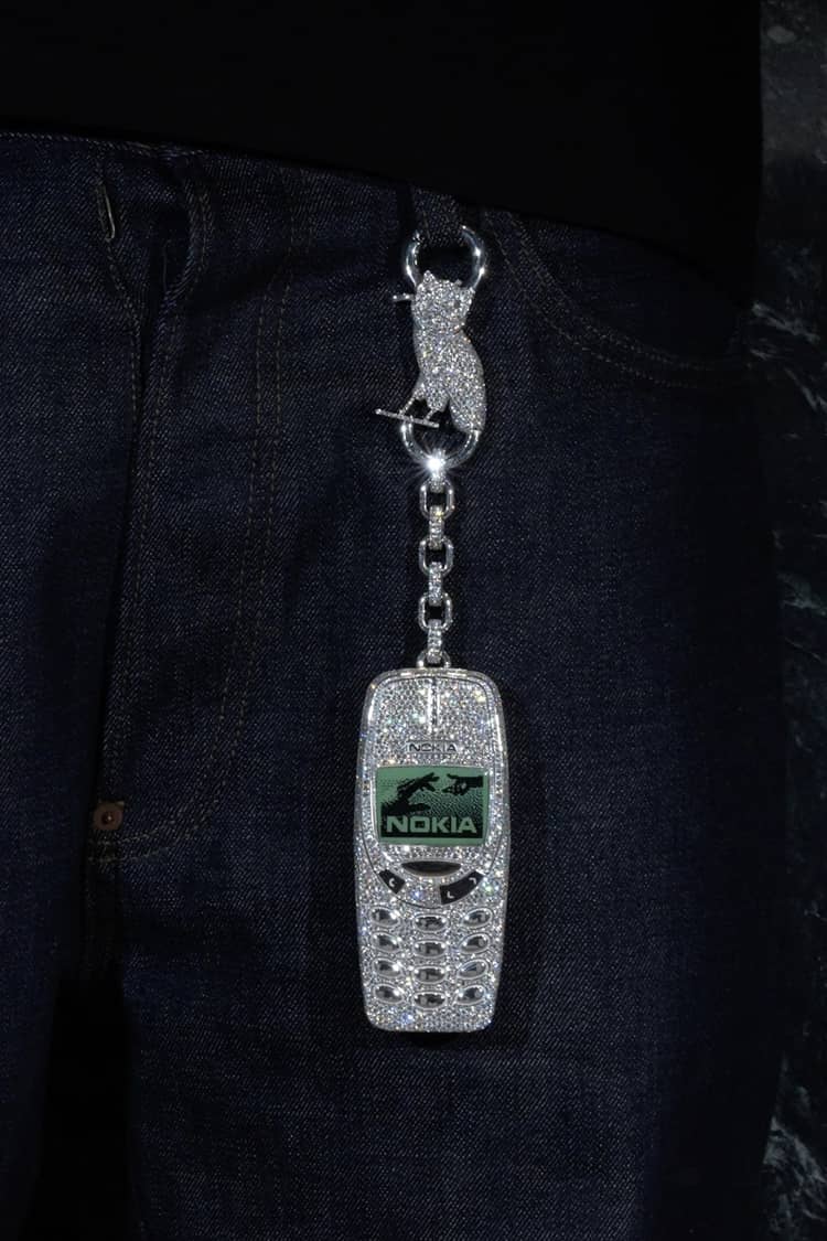 Custom iced-out Nokia phone and “SSS4U” diamond pendant created by Alex Moss NY for Drake, totaling over 150 carats