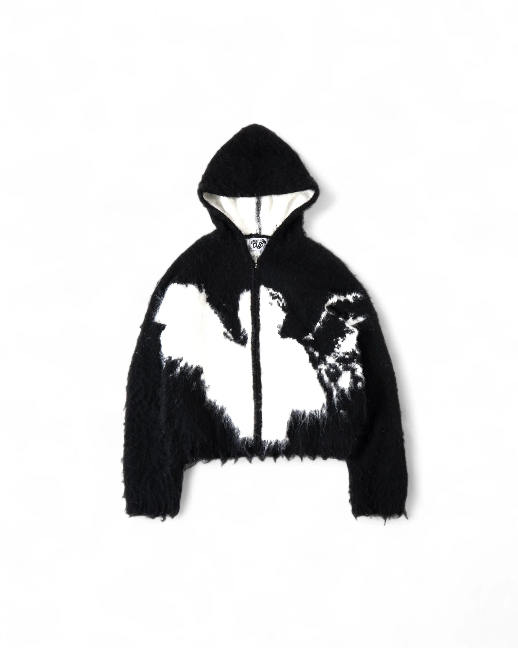 WHATHAPPENEDTOGOD “ANGEL” mohair zip in black, its fibers haloed by light, evoking celestial defiance.