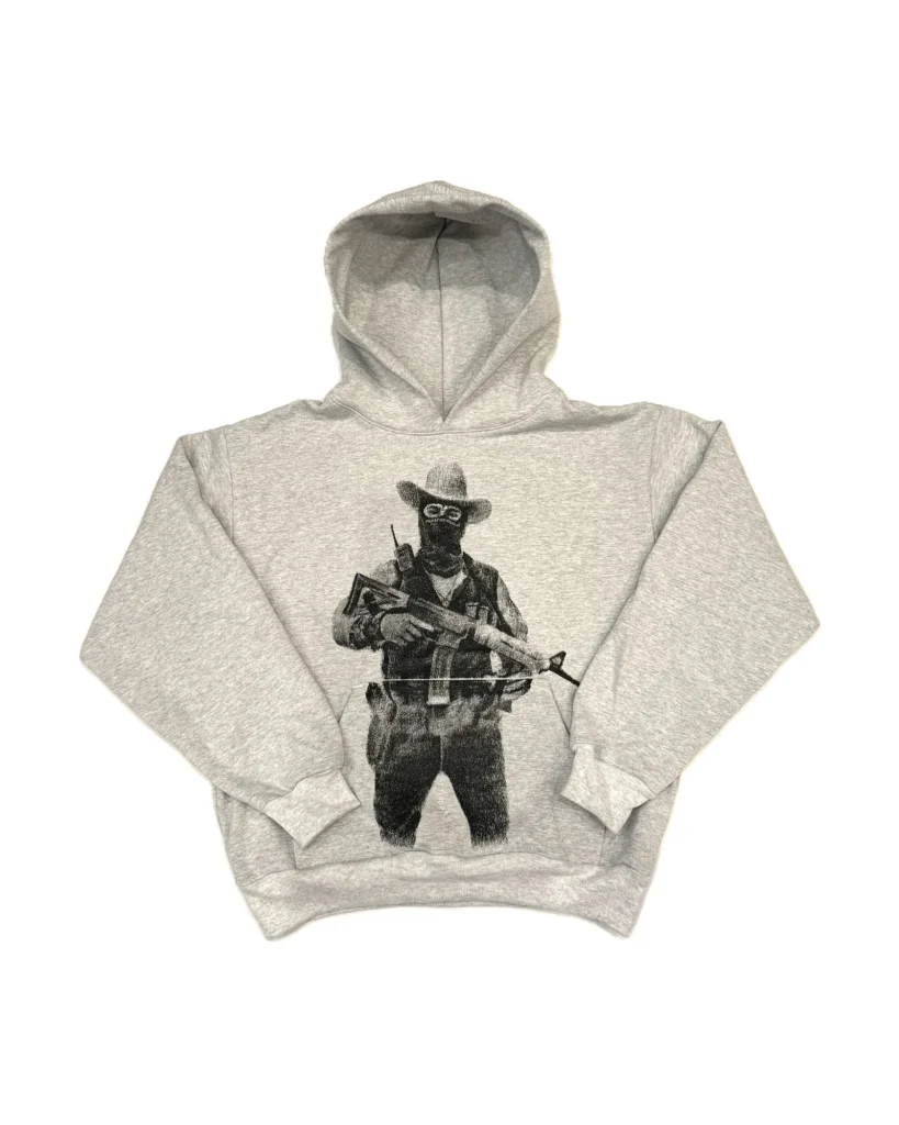 Grey hoodie featuring a bold black graphic of a masked figure in a cowboy hat with a rifle, by PARAPHERNALIA