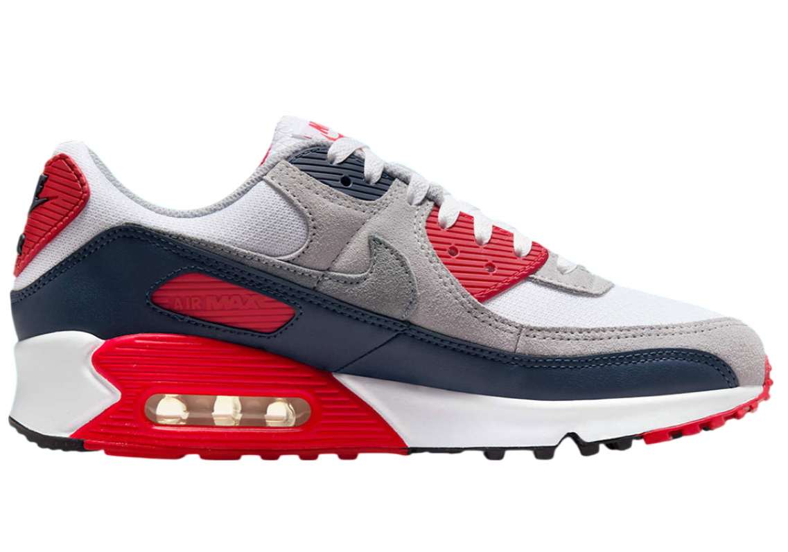Nike Air Max 90 sneaker in Cool Grey and University Red, featuring classic visible Air unit and bold color contrast