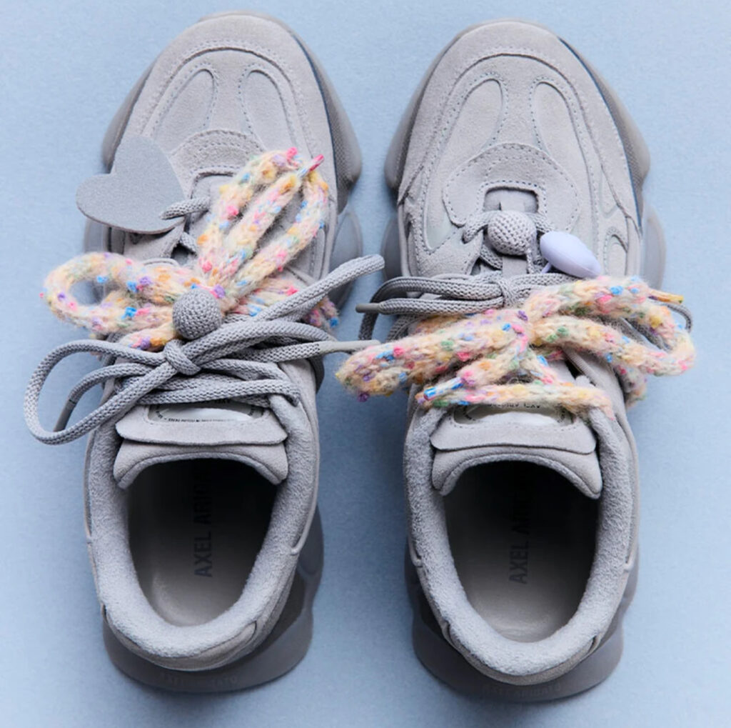 Side profile of the Axel Arigato Eris shoe showing oversized outsole and paneled leather-sueded upper