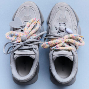 Side profile of the Axel Arigato Eris shoe showing oversized outsole and paneled leather-sueded upper