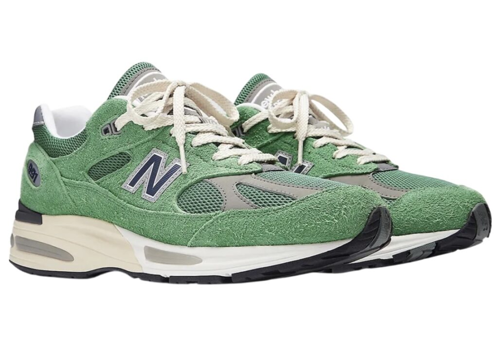 New Balance 991v2 in Mineral Green and Comfrey, showcasing suede and mesh upper with FuelCell midsole and UK craftsmanship