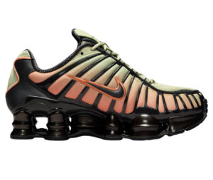 Nike Shox TL shoe in black with bright mango accents and full-length visible spring cushioning columns