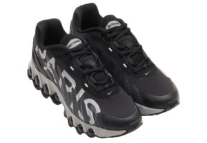PSG x Nike Air Max DN8 sneaker in black and anthracite with dual air sole and tonal PSG crest, shown in side profile