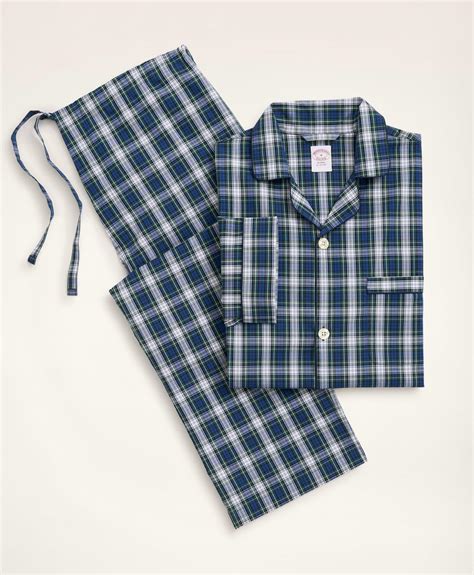 A neatly folded set of Brooks Brothers Long Pajamas in blue and white striped cotton, highlighting classic design and soft texture