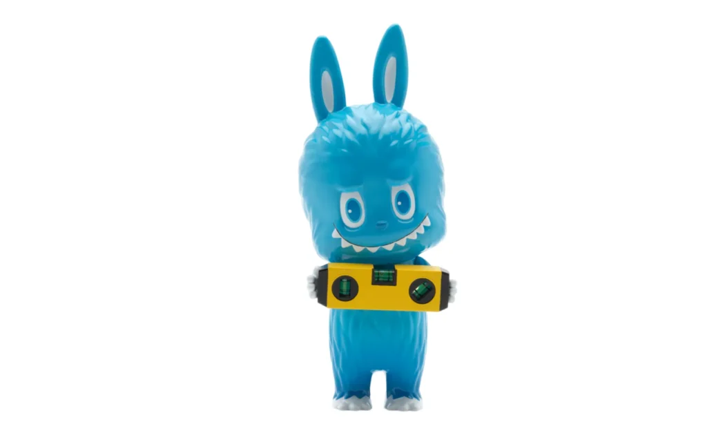 Porcelain Labubu doll by Kasing Lung in blue, holding a spirit level, created exclusively for Art Basel 2025.