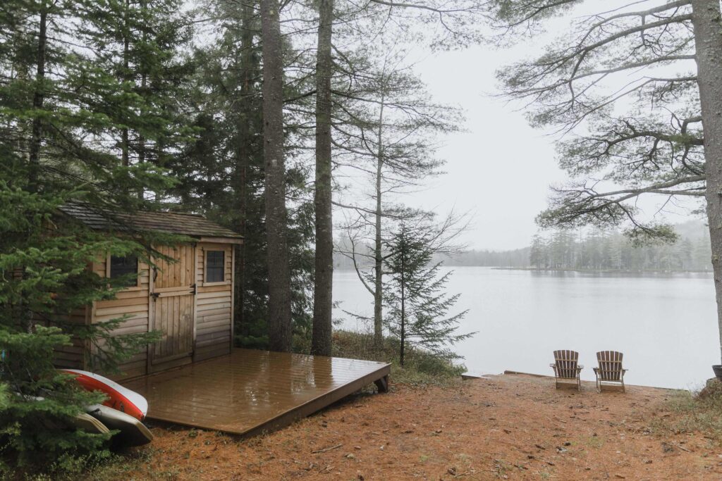 cabins, canoes, lakeside, evergreens trees, an image of such