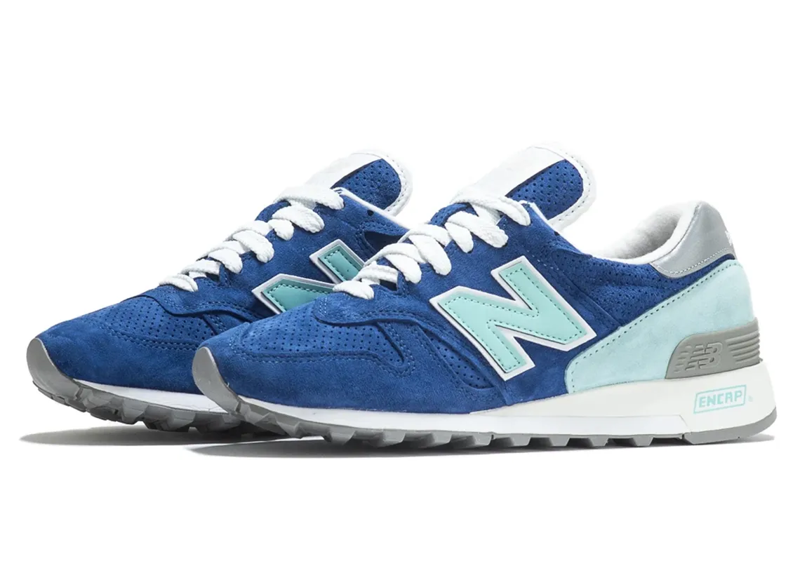 New Balance 1300 sneaker in blue and white, featuring ENCAP sole, suede and mesh upper, and signature “N” logo