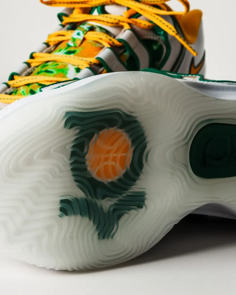 Close-up of the Nike KD 18 ‘Sonics’ shoe showcasing its green and yellow Seattle colorway and sleek performance design