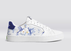 Side view of the White Smooth Leather Salvas Shoe with bold blue parrot print detailing on premium leather upper