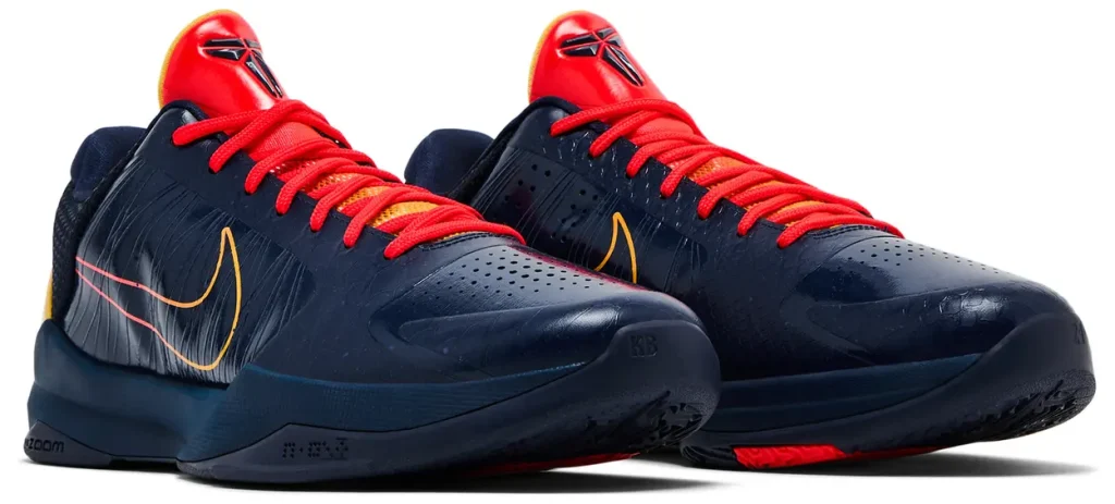 Caitlin Clark x Nike Zoom Kobe 5 Protro 'Indiana Fever' shoe in navy with red and amber gradient accents, showcasing Flywire and Zoom Air tech