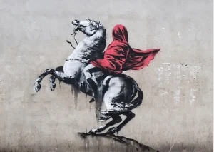 Banksy’s 2018 mural in Paris depicting Napoleon on a rearing horse with a red cloak covering his head, critiquing nationalism