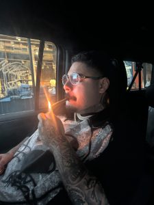 That Mexican OT sitting in an Escalade, laughing with a mic in hand, wearing a colorful trucker hat and diamond grill