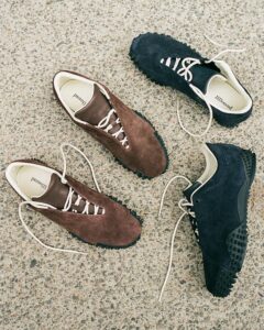 PUMA x JJJJound Mostro shoes in brown and blue nubuck with minimalist lacing, subtle stitched Formstrip, and soft yellow interior lining