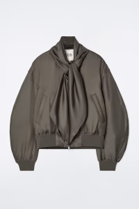carf-detail padded silk bomber jacket in bronze color shown without model, highlighting draped scarf, smooth silk texture, and padded silhouette
