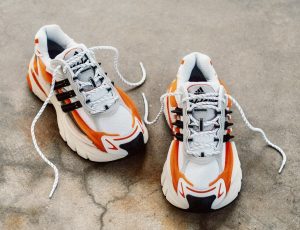 adidas “Jellyfish” sneaker designed by Pharrell Williams in white, orange, and black with futuristic layered design