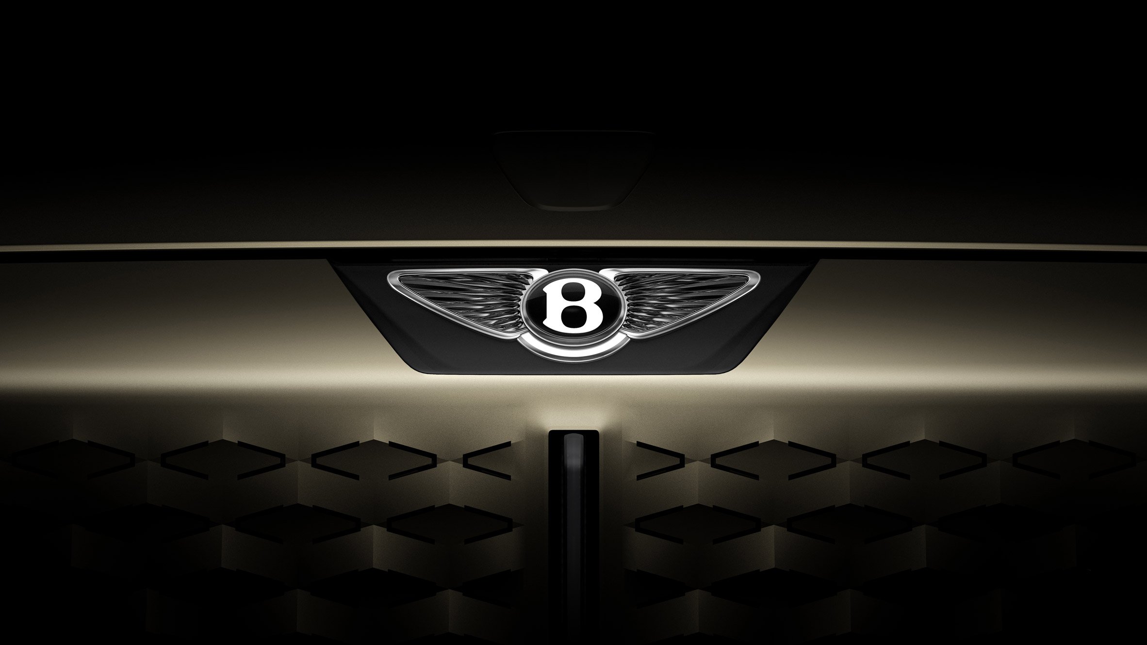 The new simplified Bentley Winged B logo design, showcasing modern flat lines and horizontal wings for 2025 concept cars