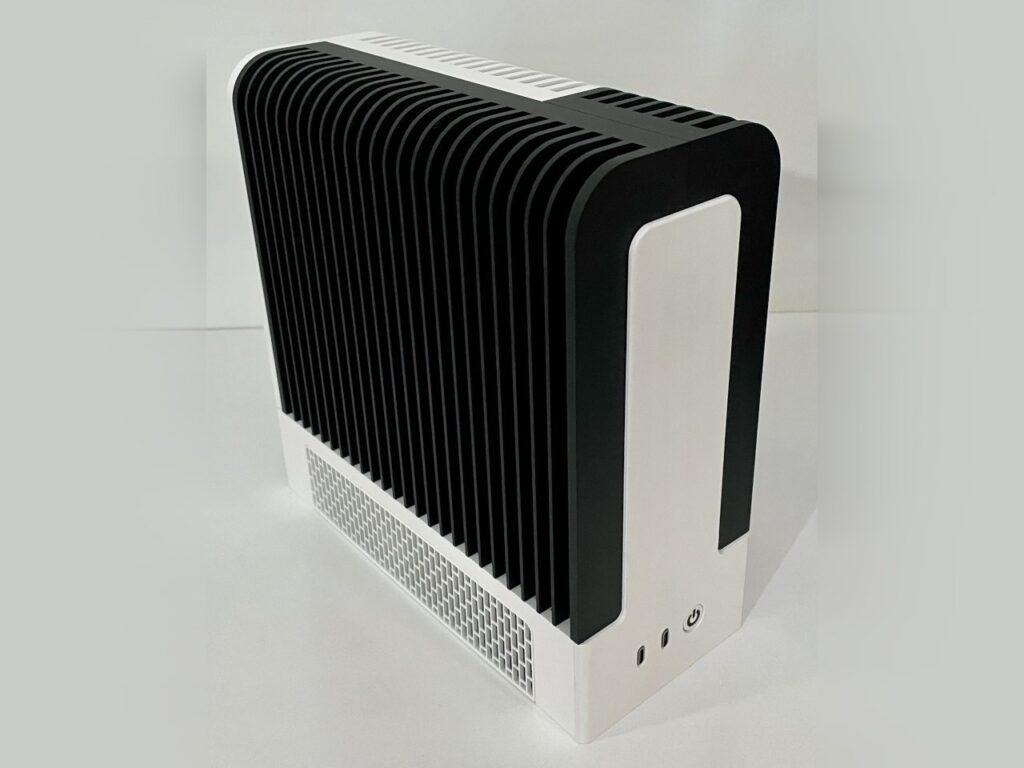 Monochrome desktop build by TheJiral: black-and-white 3D-printed fanless PC showcasing minimalist, silent design with Framework mainboard