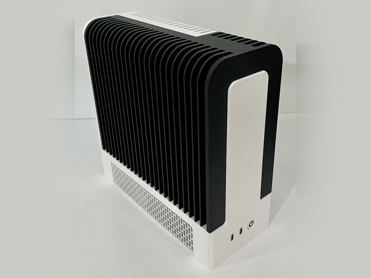 Monochrome desktop build by TheJiral: black-and-white 3D-printed fanless PC showcasing minimalist, silent design with Framework mainboard