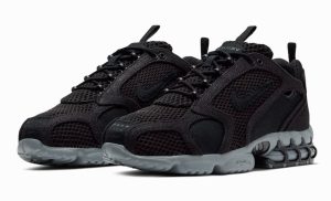 Stüssy x Nike Air Zoom Spiridon Cage 2 sneaker in Black and Cool Grey, showcasing mesh upper and TPU cage detailing