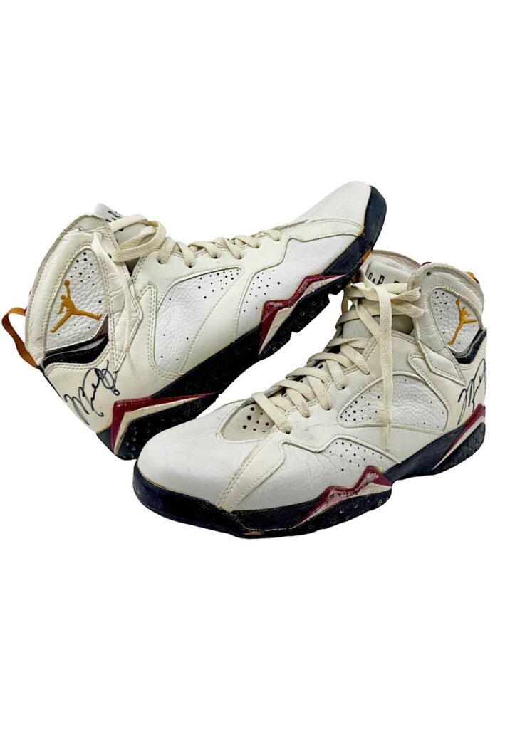 Pair of game-worn and autographed Air Jordan VII sneakers from Michael Jordan’s 1992–93 Chicago Bulls season, featuring white leather with maroon and black accents.