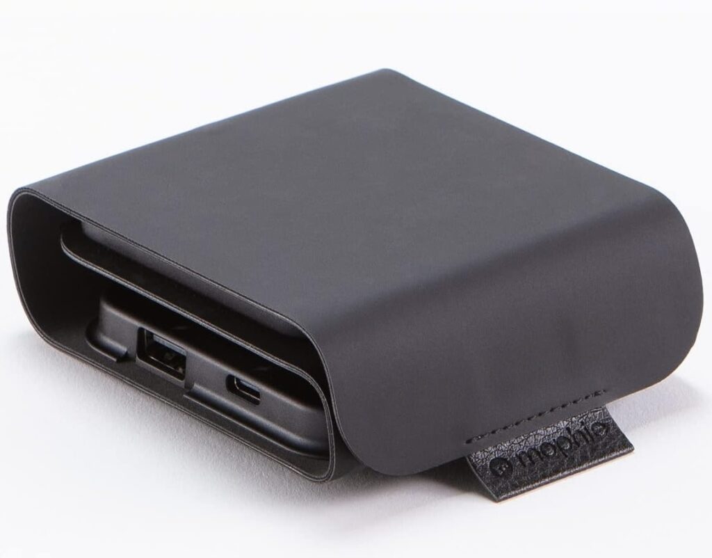 Mophie Snap+ Multi-Device Travel Charger folded inside its black travel case, showing USB-C and USB-A ports with a branded leather pull tab.