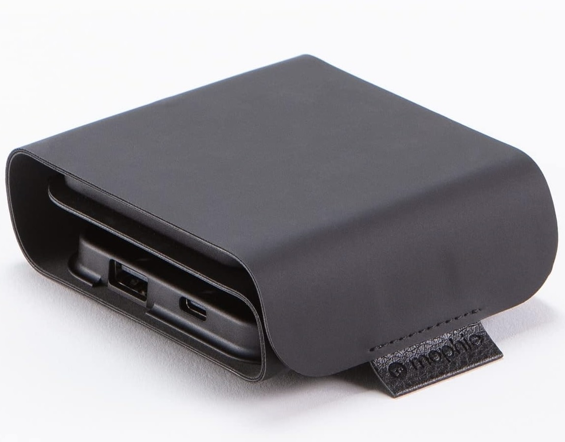 Mophie Snap+ Multi-Device Travel Charger folded inside its black travel case, showing USB-C and USB-A ports with a branded leather pull tab.
