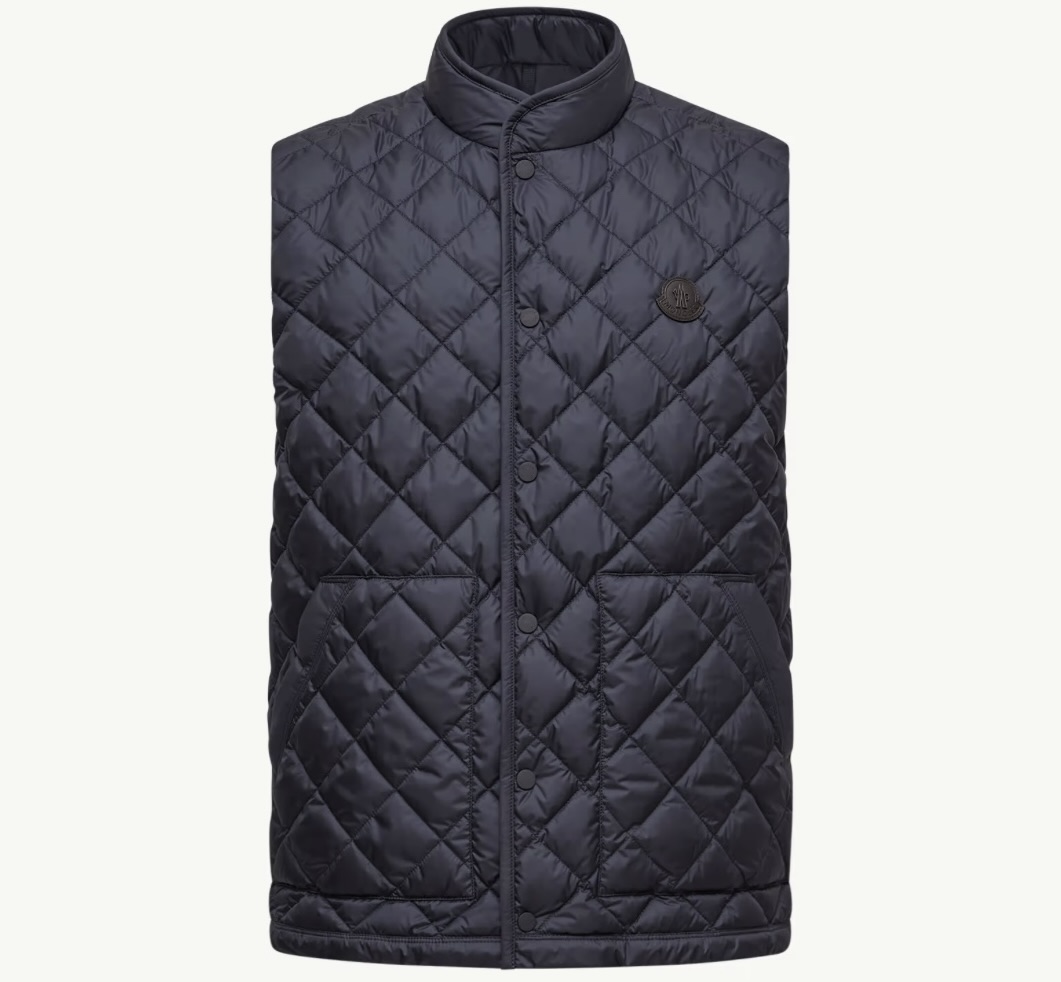 Front view of the Moncler Lycope Diamond-Quilted Down Vest in black, featuring a high collar, snap-button closure, two front pockets, and the Moncler logo patch on the chest.
