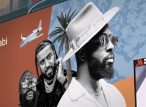 Billboard artwork featuring Wyclef Jean, French Montana, and Rick Ross.