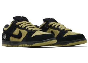 Supreme x Nike SB Dunk Low “Camper Green” sneakers featuring olive green suede uppers, black overlays, black Swoosh, and embroidered “94” detail on the heel, displayed in a three-quarter view.