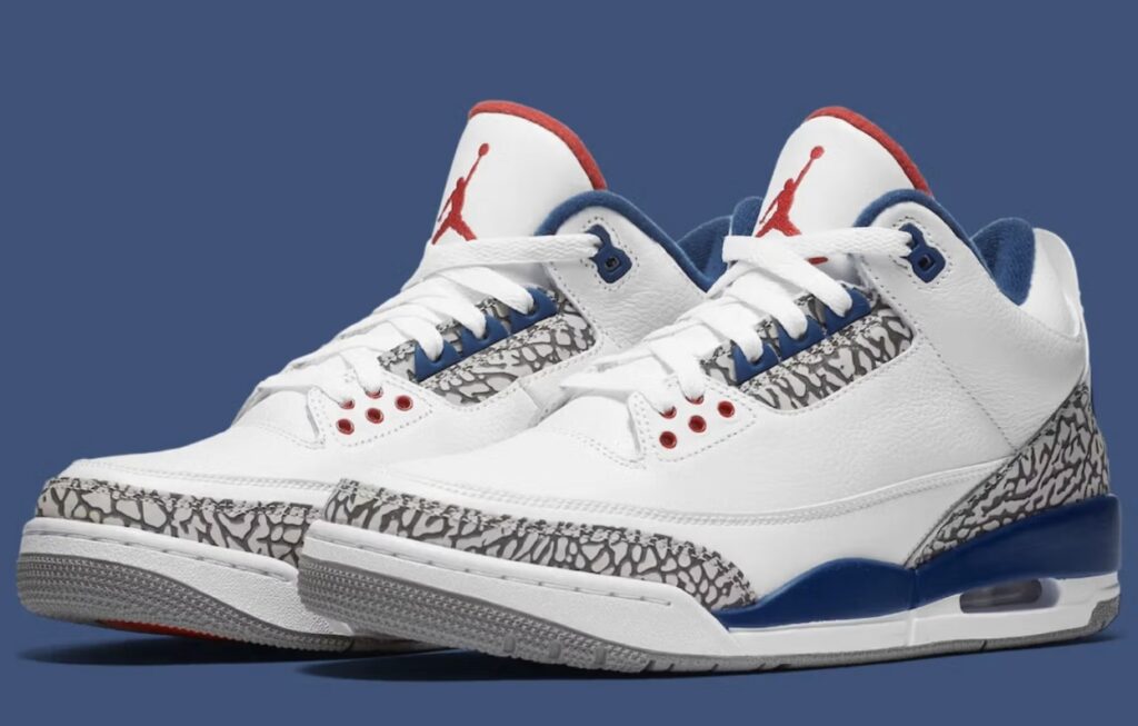 Air Jordan 3 True Blue 2026 retro — side view showcasing white tumbled leather upper, iconic elephant print overlays, True Blue midsole accents, and Varsity Red Jumpman logo on the tongue.