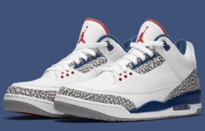 Air Jordan 3 True Blue 2026 retro — side view showcasing white tumbled leather upper, iconic elephant print overlays, True Blue midsole accents, and Varsity Red Jumpman logo on the tongue.