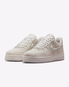 Nike Air Force 1 Low ’07 “Light Orewood Brown” from the Suede Pack, featuring a tonal suede upper with white midsole and gum outsole, photographed in studio lighting.