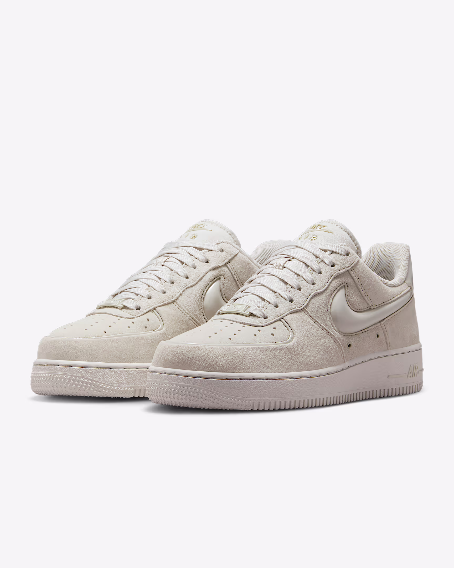 Nike Air Force 1 Low ’07 “Light Orewood Brown” from the Suede Pack, featuring a tonal suede upper with white midsole and gum outsole, photographed in studio lighting.