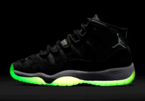 Air Jordan 11 Inner Beast sneaker in black with glow-in-the-dark neon green outsole and embroidered Jumpman logo.