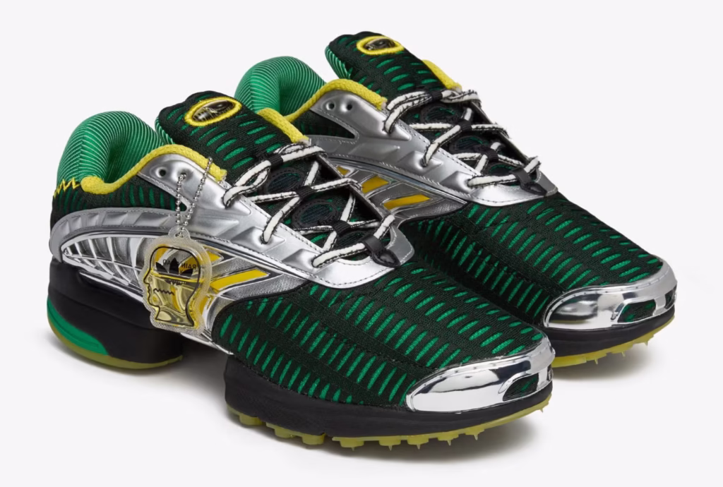 Image of the Brain Dead x adidas Climacool 2 sneaker in “Signal Green” colorway, photographed on a textured grey backdrop. The shoe features a ventilated mesh upper, sculpted TPU side ribs, and layered midsole vents. Brain Dead’s brain logo appears on the heel tab, while adidas’ three stripes are subtly integrated into the mesh structure. The design merges early-2000s tech aesthetics with Brain Dead’s experimental streetwear sensibility.