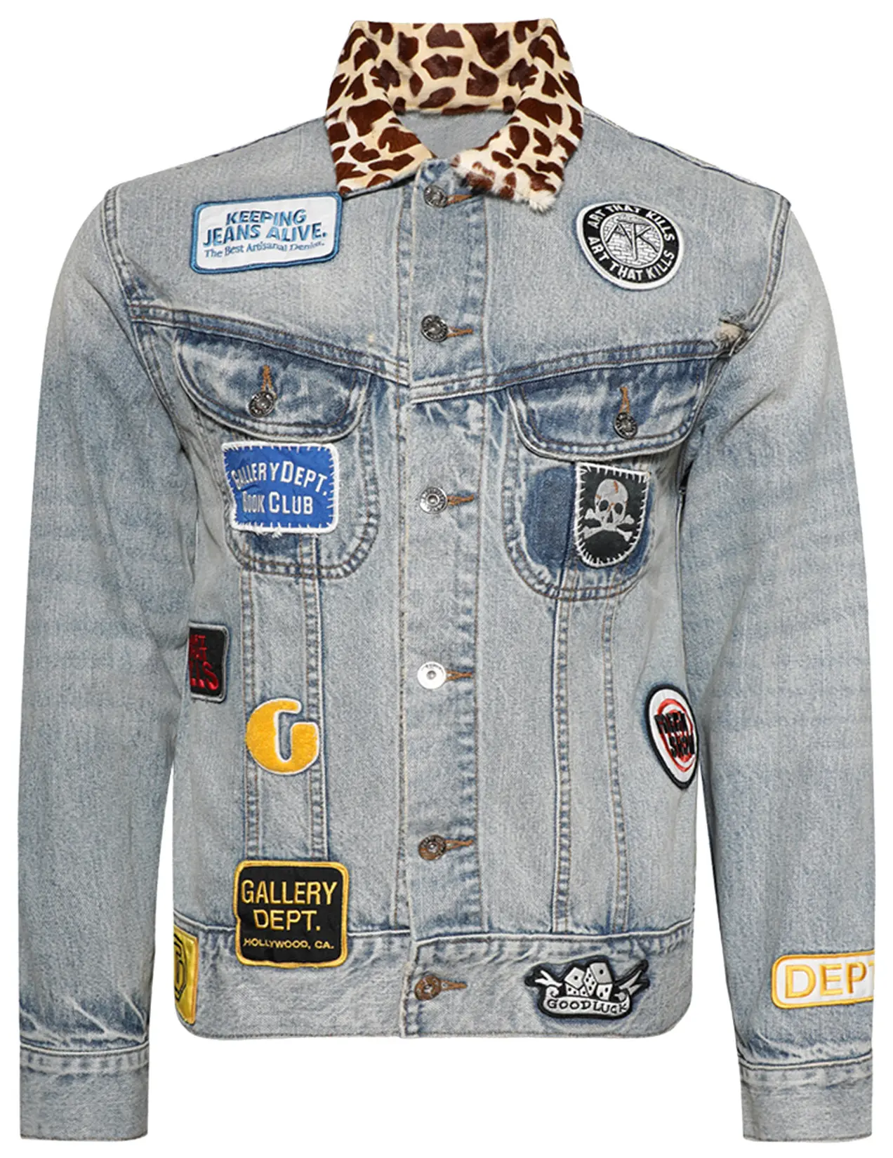 Gallery Dept. Headline Denim Jacket in Washed Indigo featuring a leopard-print faux fur collar and multiple embroidered patches, including “Gallery Dept. Hollywood, CA,” “Keeping Jeans Alive,” and “Art That Kills.” The light-wash denim is distressed with a vintage fade, giving the jacket an artistic, handcrafted aesthetic that blends streetwear attitude with retro Americana influences.