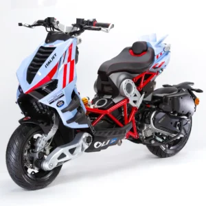 2025 Italjet Dragster Gresini Racing MotoGP Replica Limited Edition scooter — a performance-oriented urban machine featuring a light blue Gresini Racing livery with red and white accents, exposed red trellis frame, Öhlins rear suspension, and aerodynamic winglets inspired by MotoGP design. Photographed in studio on a white background
