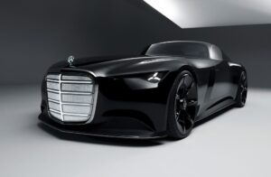 Mercedes-Benz Vision Iconic concept car in black, photographed in a minimalist studio under soft white lighting. The vehicle features a sweeping coupé silhouette, illuminated Art Deco-inspired grille panels, and the signature three-pointed star hood ornament, evoking both vintage elegance and futuristic electric design.