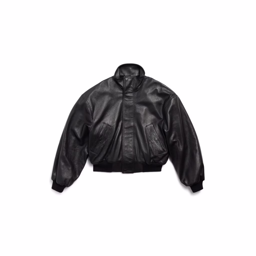 Balenciaga Garde-Robe Blouson in black semi-shiny grainy leather, women’s cropped jacket with structured shoulders and minimalist tailoring, front view.