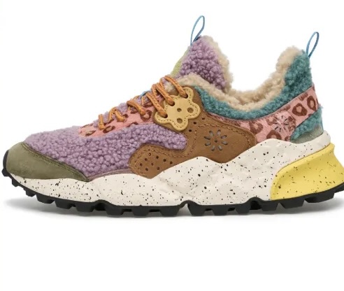 Flower Mountain sneaker featuring a plush lilac shearling upper with tan suede overlays, pink leopard-print accents, and a speckled cream midsole. The shoe includes teal and yellow detailing with a rugged black outsole, blending cozy textures and outdoor-inspired design.