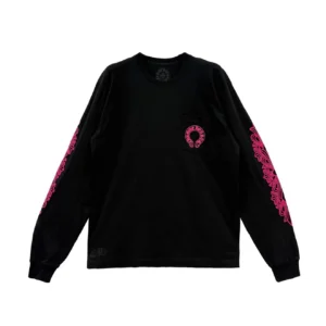 Front view of the Chrome Hearts Black Pink Floral Longsleeve showcasing a small chest pocket with the brand’s circular pink logo, complemented by bold pink floral cross patterns running along both sleeves on a solid black cotton base.